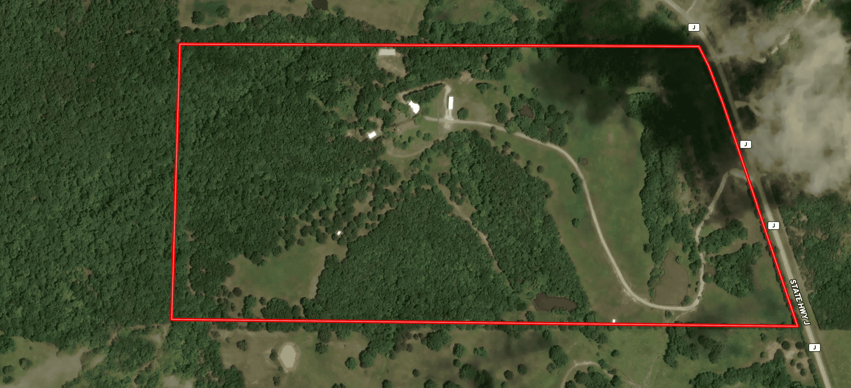 88-Acre Horse Farm with Custom Ranch Home, Stables, Ponds & Private Gated Drive